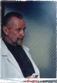 Jeffrie Peterson as the Coroner