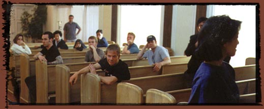 Between takes, the crew wait for the next shot.